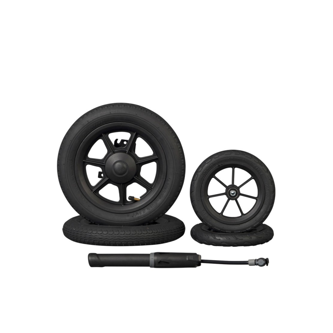 Four black stroller wheels of different sizes, ideal for the Rollz Motion Rollator, are displayed with a compact hand pump on a plain white background.